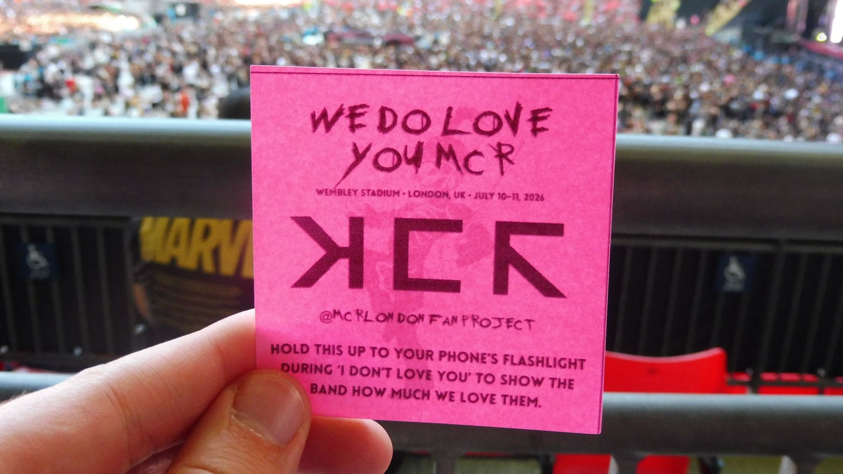 My Chemical Romance fans at Wembley Stadium July 2026 holding We Do Love You MCR fan project card