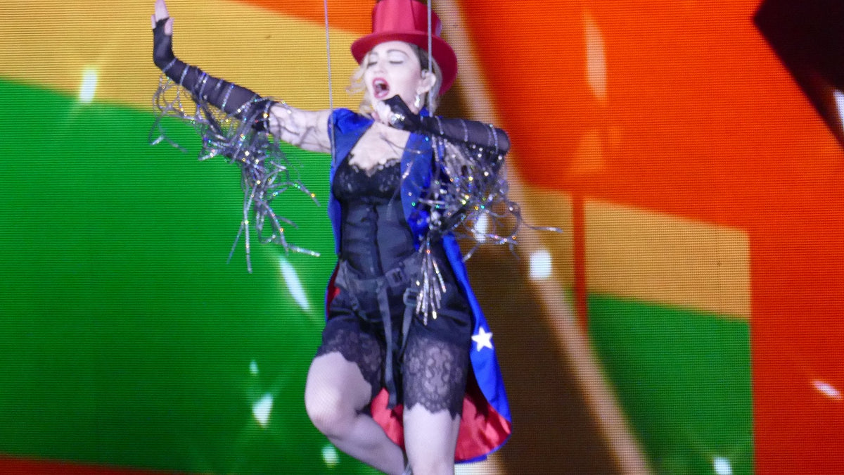 Madonna performing live on stage during the Rebel Heart Tour, Madonna Evita vinyl guide