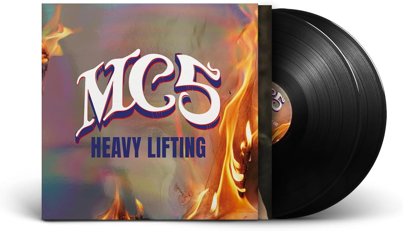 Vinyl record with colorful cover featuring 'MCS' and 'Heavy Lifting'